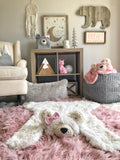 White fluffy polar bear rug made by ClaraLoo on the floor of a forest themed nursery.
